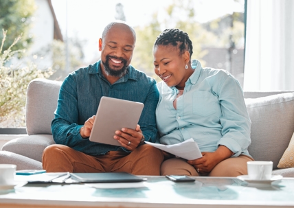 older couple happily reviewing documents