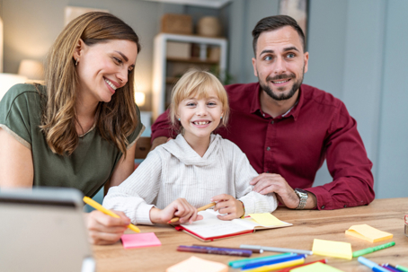 parents and daughter in an office
