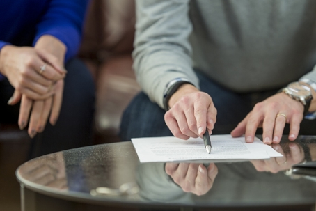 couple signing a document