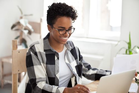 woman reading off computer screen
